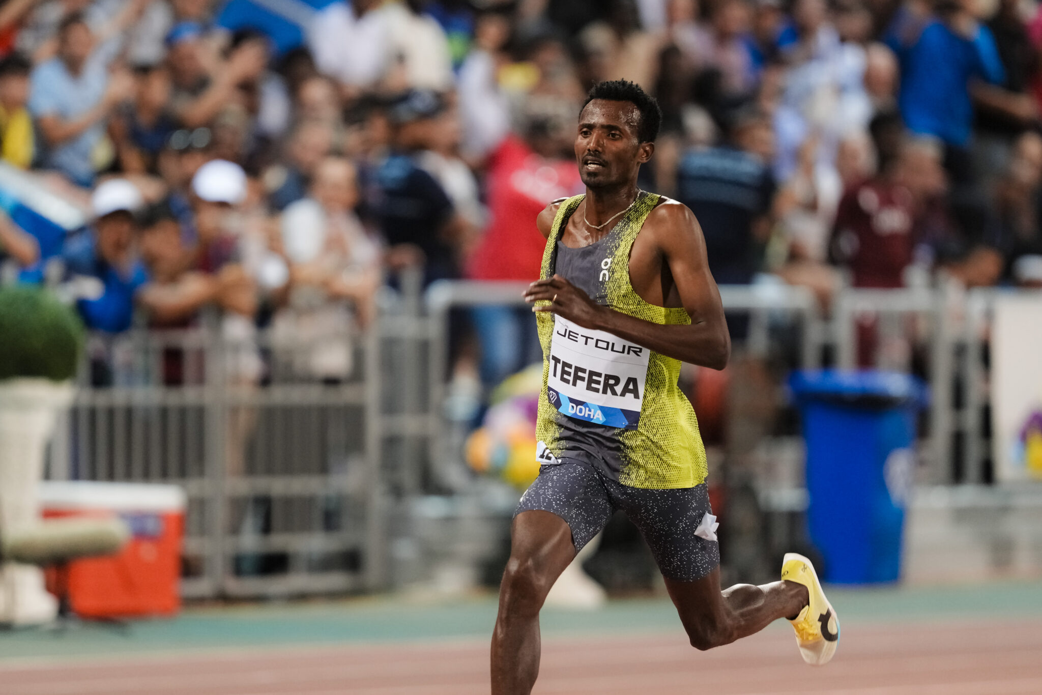 On signs the Ethiopian 1500m World Indoor Champion, Samuel Tefera ...