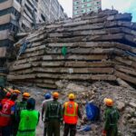 Rescue workers at the collapsed building in Eastleigh, Nairobi