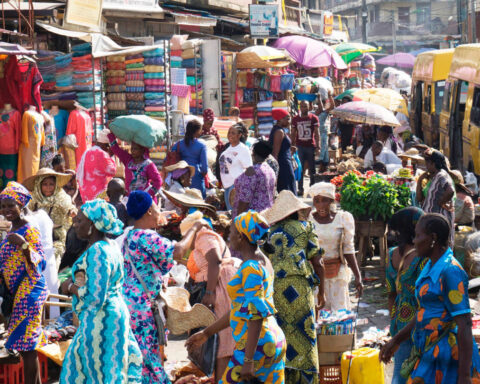Crowded Lagos market with traders and shoppers